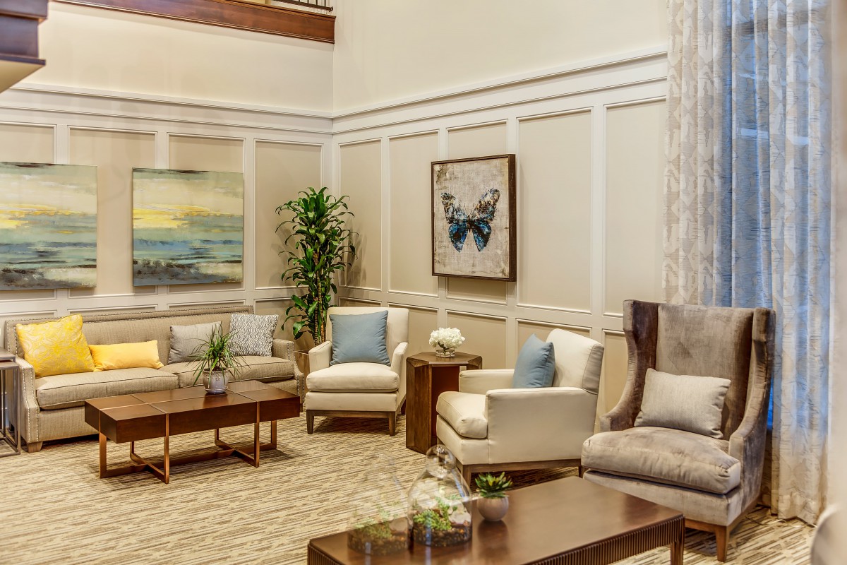 A modern living room with comfortable seating and elegant decor.