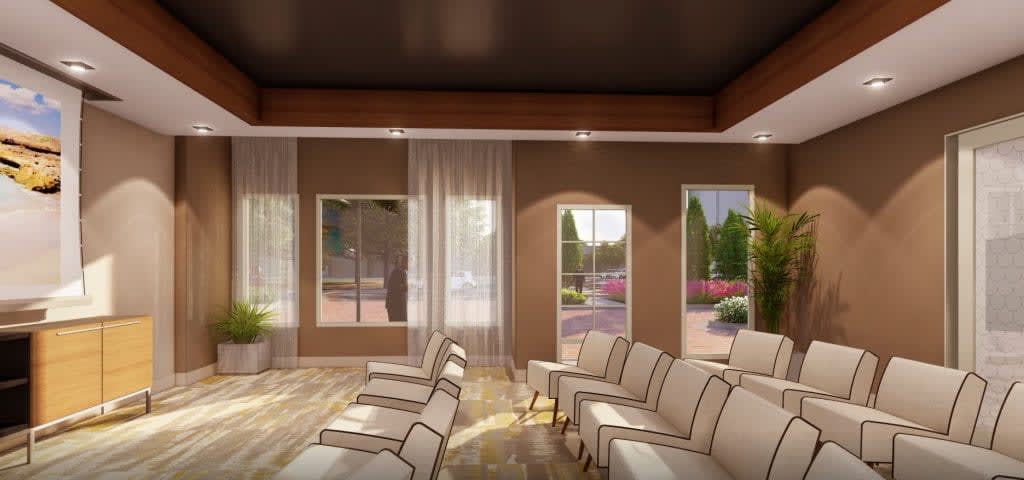 A modern lounge area with comfortable seating and large windows allowing natural light.