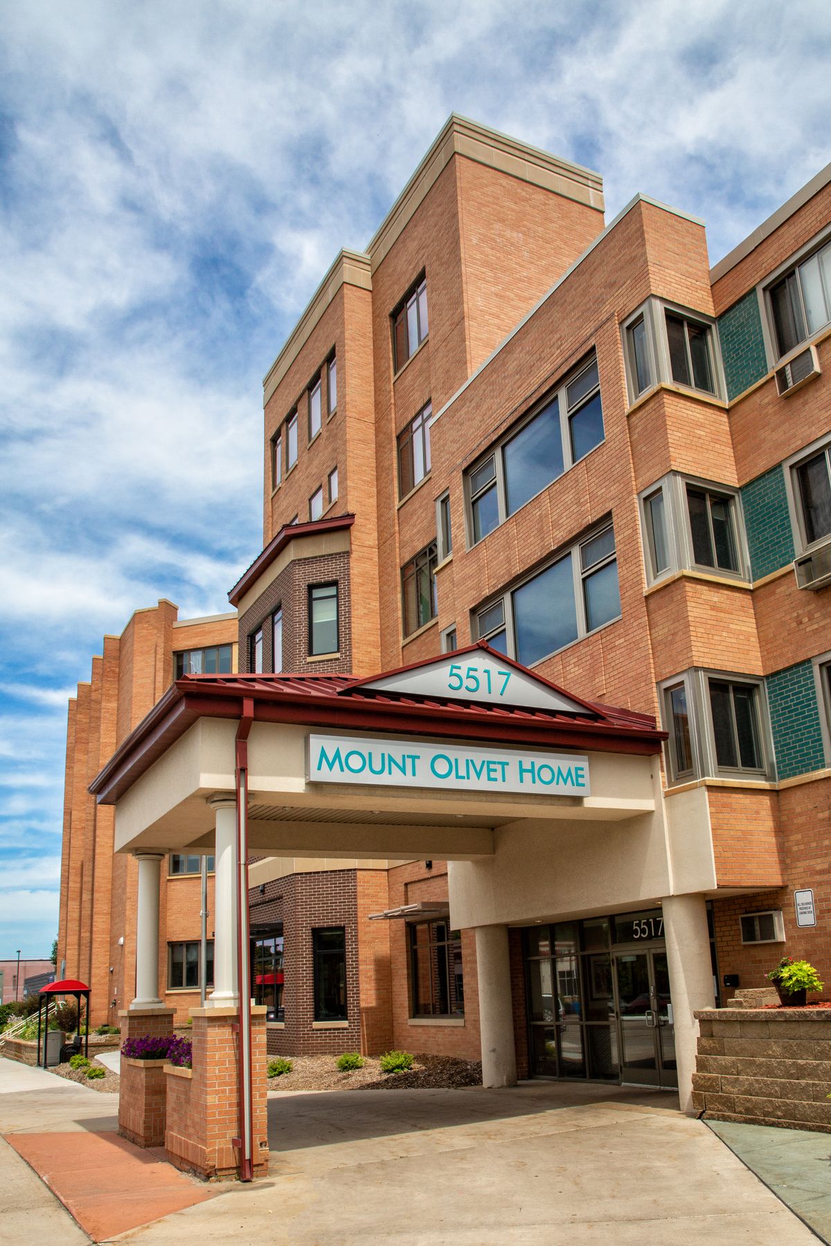 The exterior of Mount Sinai Hospital with a clear sky in the background.