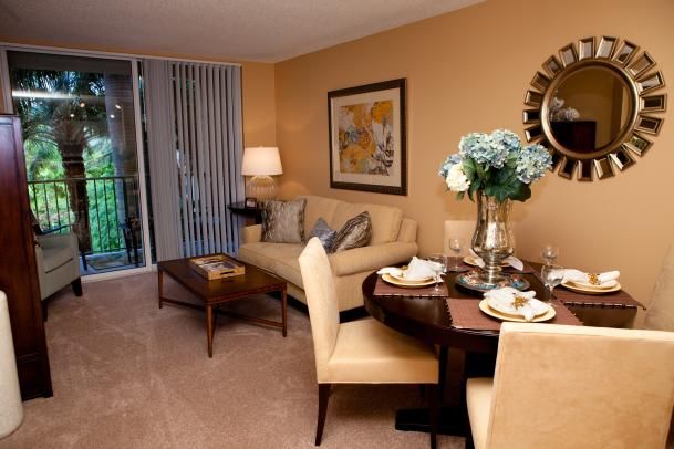 A cozy living room and dining area with elegant furnishings and decor.