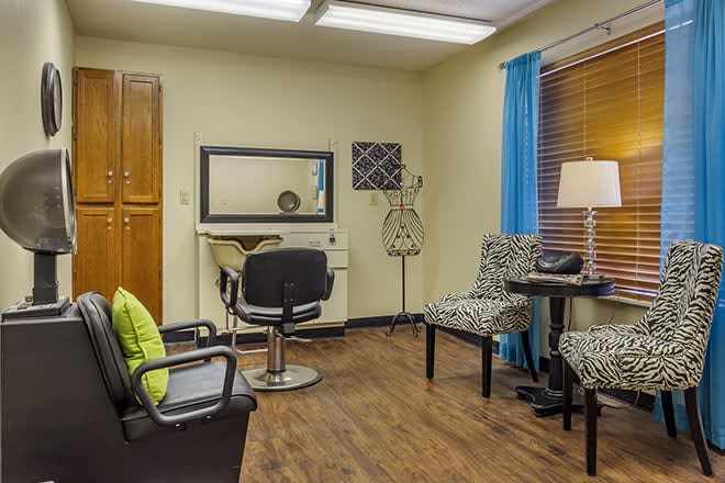 A cozy hair salon interior with styling chairs and mirrors.