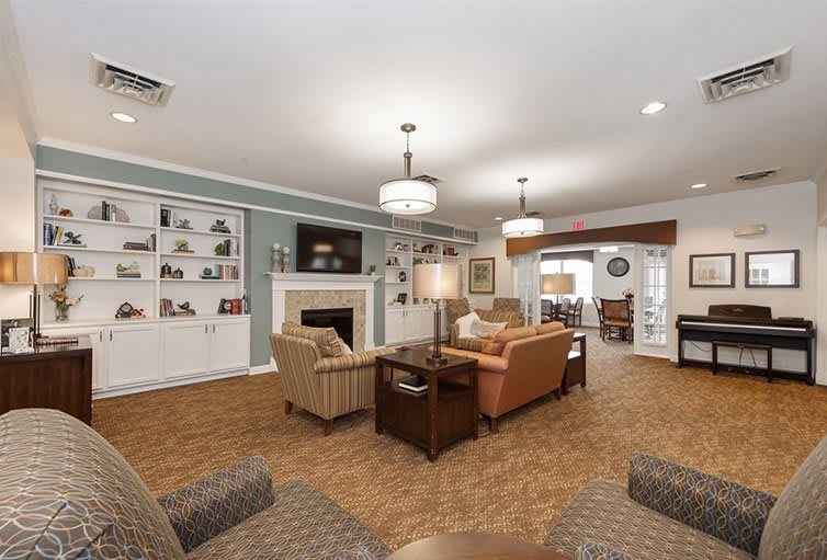 A cozy living room featuring comfortable seating, a fireplace, and stylish decor.