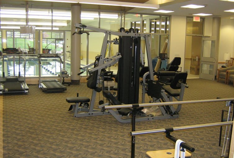 A well-equipped gym featuring various exercise machines.