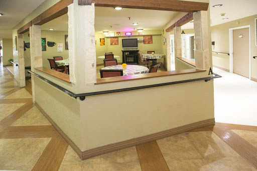 A welcoming common area in a residential facility, featuring comfortable seating and a cozy atmosphere.