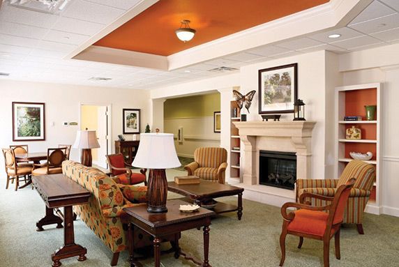 A cozy living room with comfortable seating and a fireplace.
