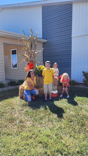 A joyful family gathering amidst fall decorations, celebrating the season.