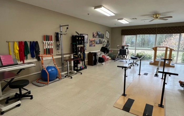 A well-equipped physical therapy room featuring various rehabilitation tools and equipment.