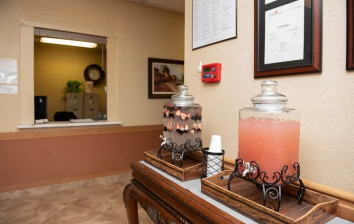 A waiting area with beverage dispensers offering refreshments.