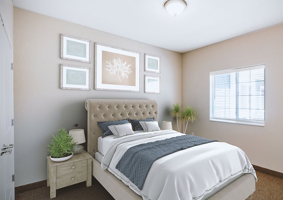 A modern bedroom with stylish decor featuring a bed with a tufted headboard, framed artwork, and indoor plants.