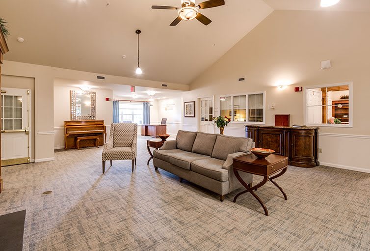 A spacious and modern living room with comfortable seating and elegant decor.