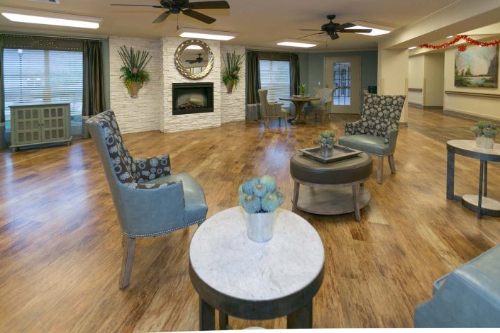 A modern living room with elegant furnishings and a cozy fireplace.