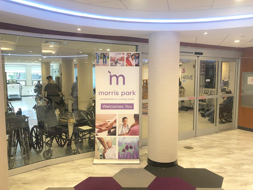 Entrance to a health facility with a rehabilitation focus, featuring a prominent banner.