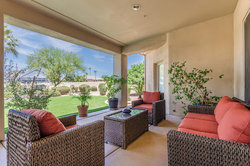 A cozy outdoor patio with comfortable seating, perfect for relaxation and enjoying the view of the garden.