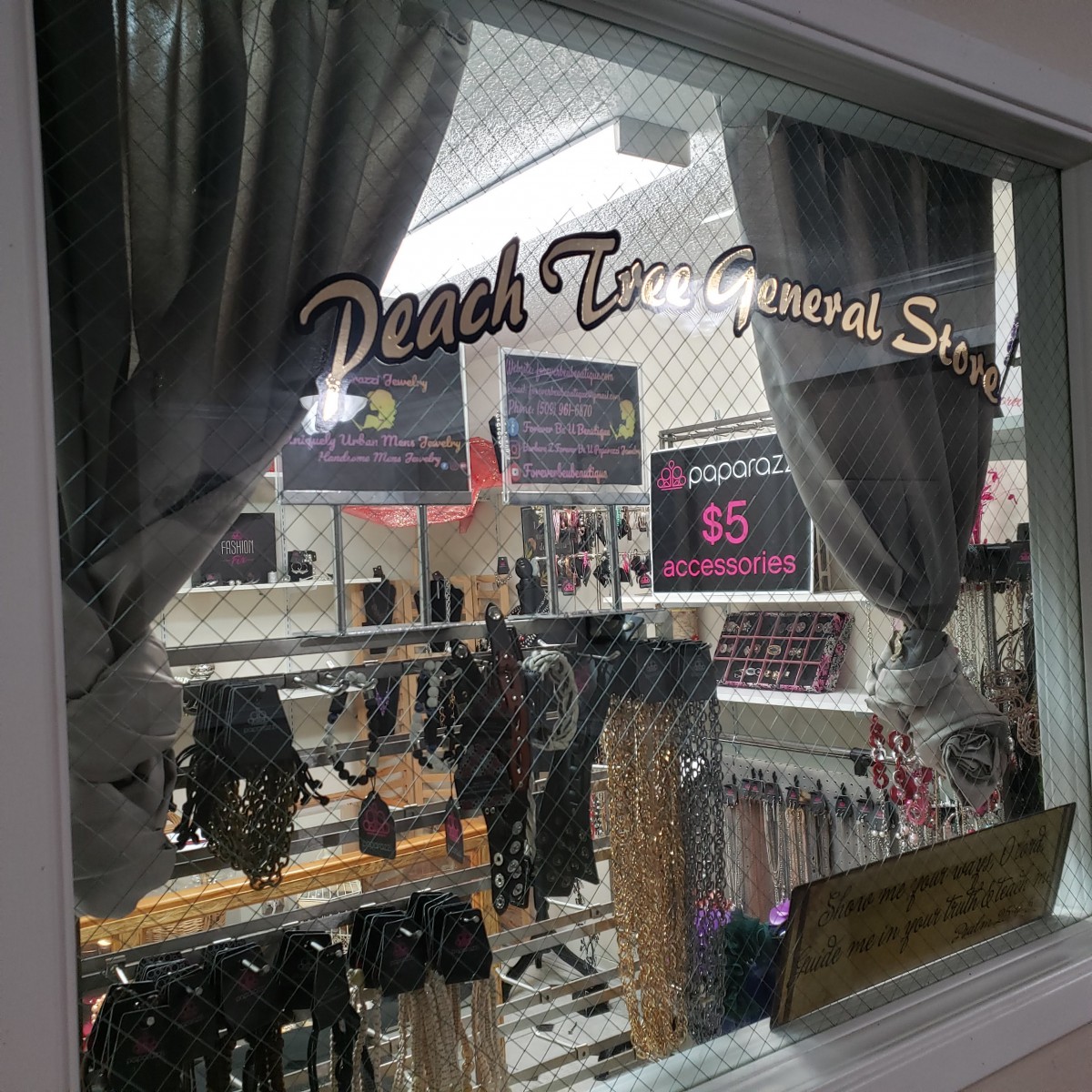 Window display of a lingerie store showcasing various items.