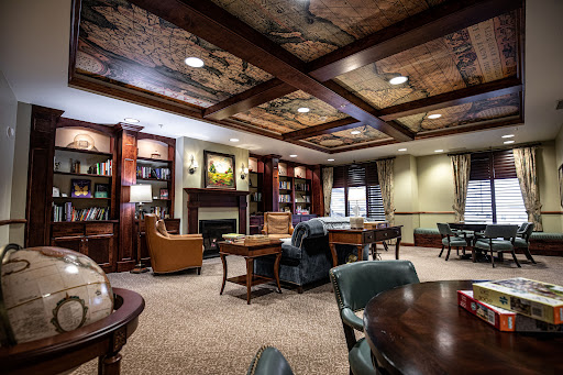 A warm and inviting lounge space featuring elegant furnishings and a cozy atmosphere.