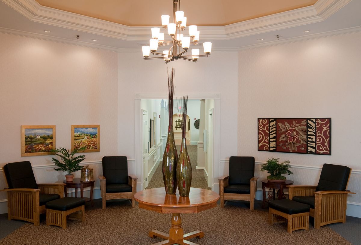 A well-decorated lobby with elegant lighting and seating arrangements.
