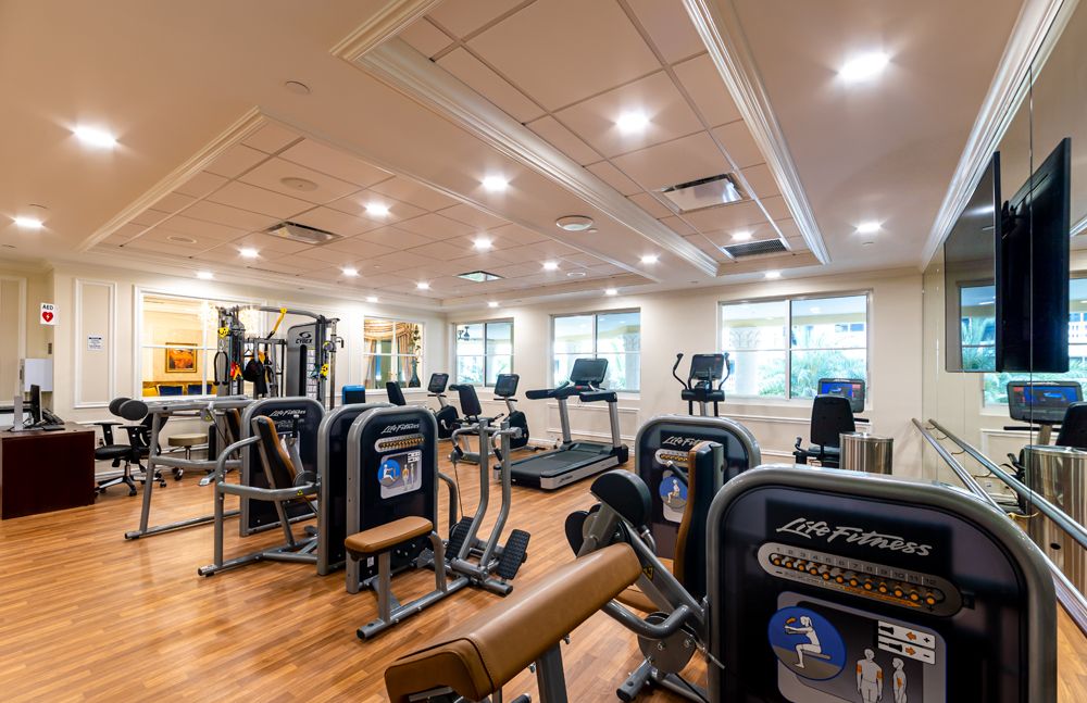 A well-equipped gym with various exercise machines for fitness enthusiasts.