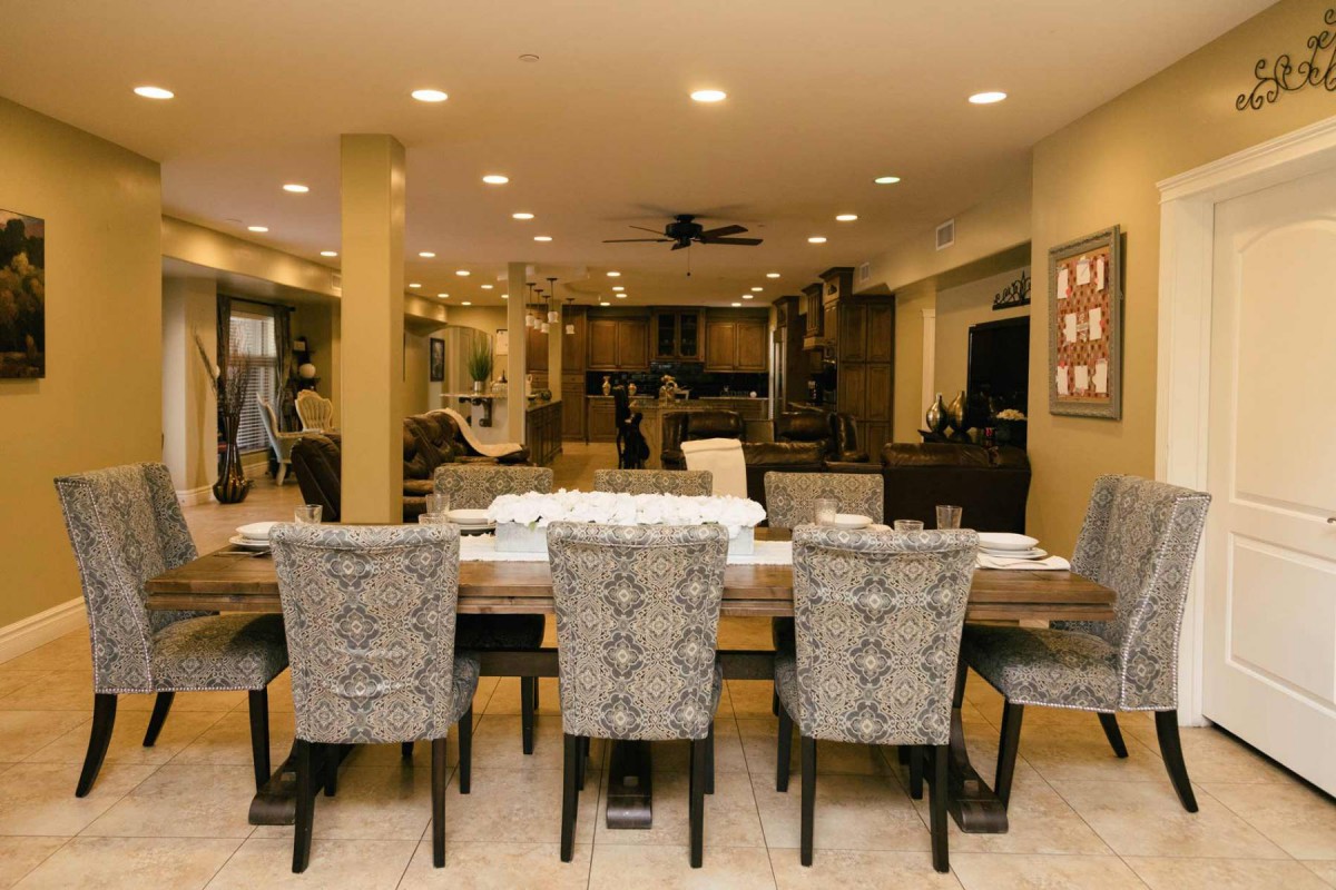 Modern dining room with an elegant table and chairs in an open-concept space.
