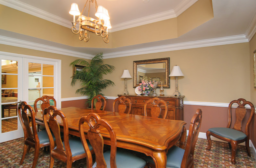 A beautifully arranged dining room featuring elegant wooden furniture and an inviting atmosphere.