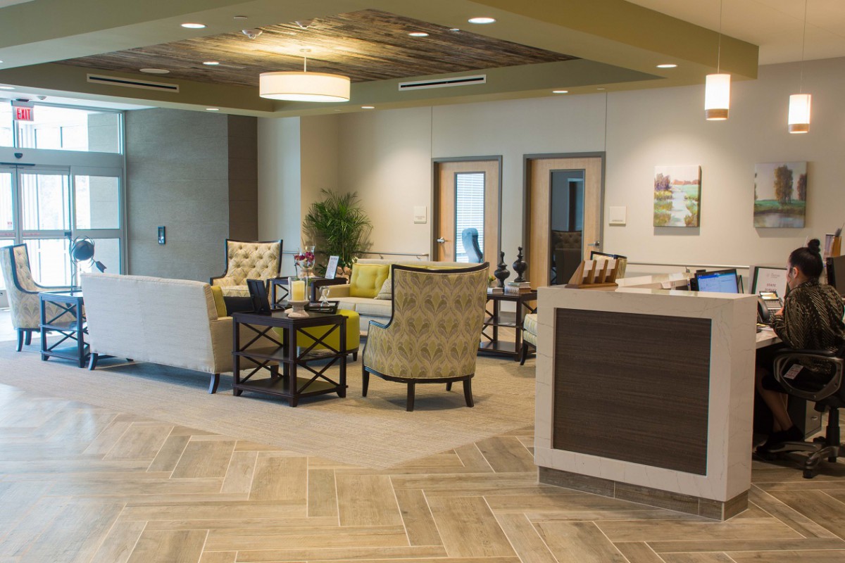 Modern office reception area with comfortable seating and contemporary design.