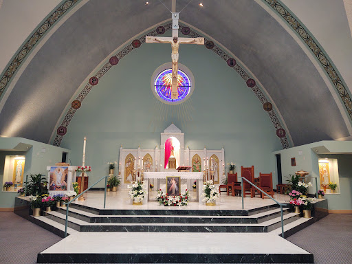 A serene interior view of a church altar with beautiful architectural details.