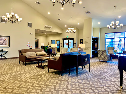 A spacious and inviting lobby area featuring modern furniture and elegant lighting.