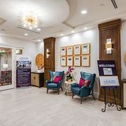 A cozy and well-decorated reception area with comfortable seating and elegant decor.