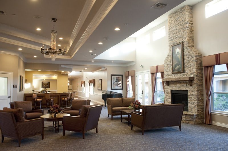 A spacious lobby with comfortable seating and a cozy fireplace.