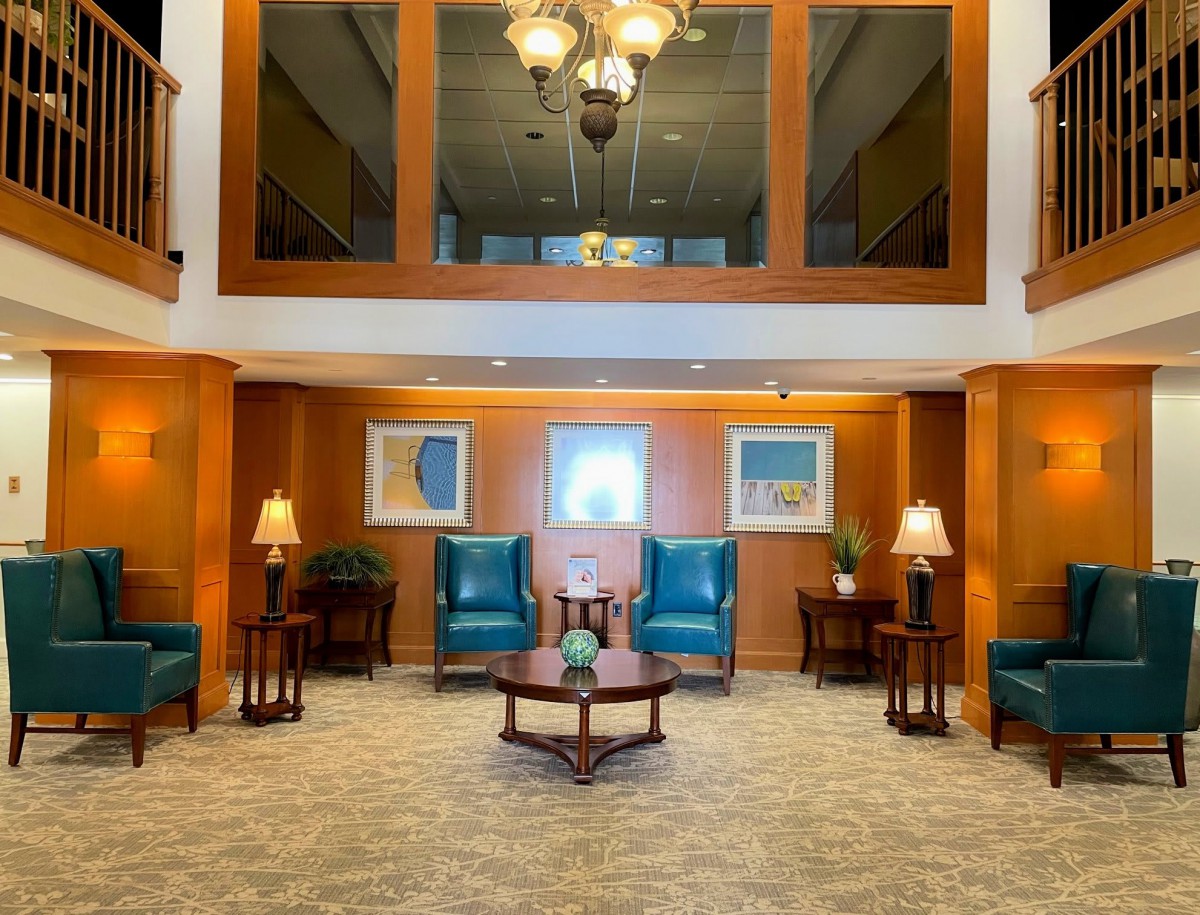 A well-lit lobby area featuring elegant seating arrangements and tasteful decor.