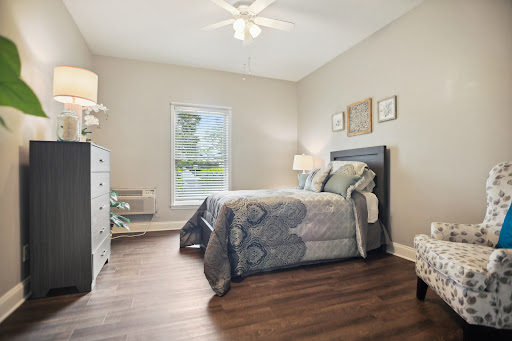 A cozy and modern bedroom featuring a comfortable bed, stylish decor, and plenty of natural light.