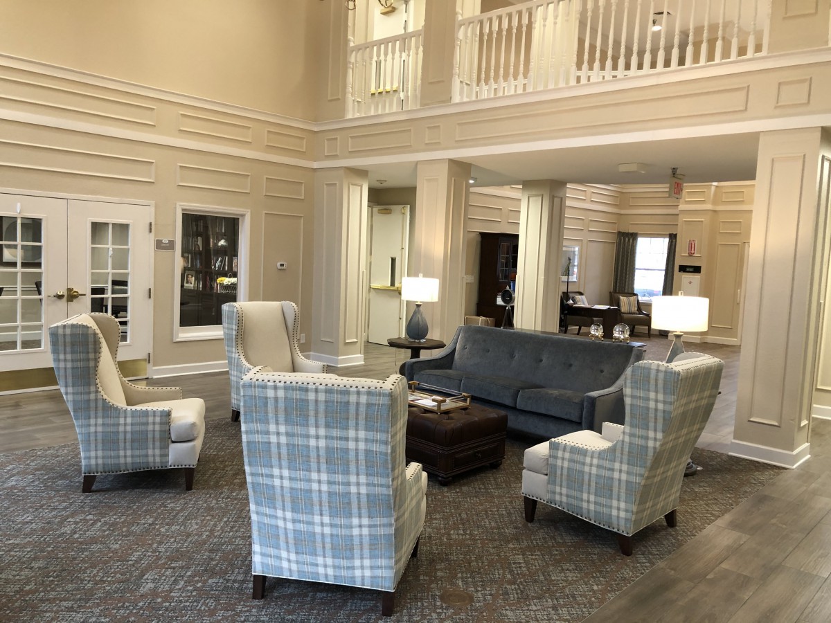 A spacious and modern lobby with comfortable seating arrangements.