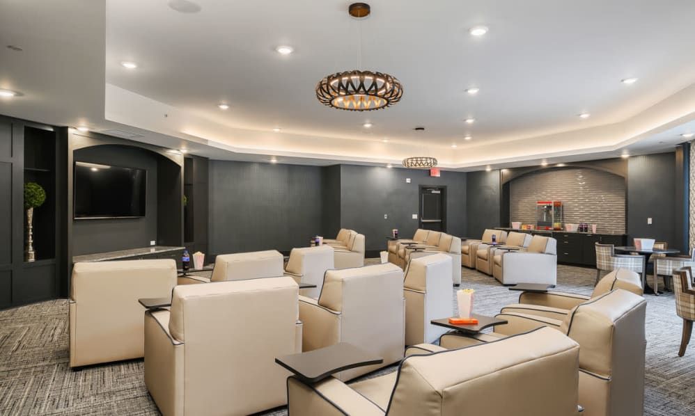 A luxurious relaxation room featuring modern upholstered seating and elegant interior lighting.