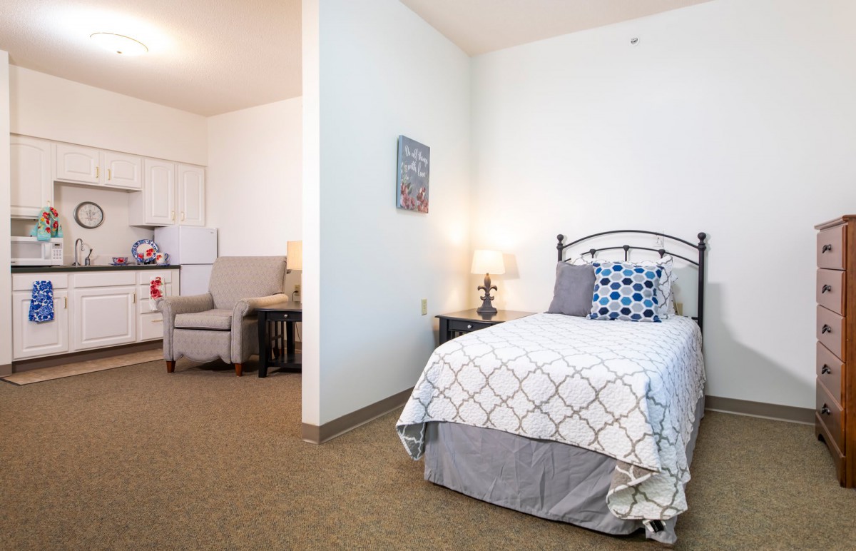 A cozy bedroom with a single bed and stylish decor.
