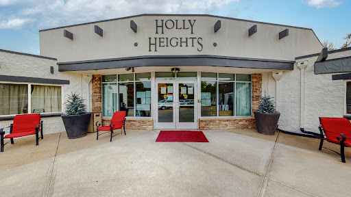 The welcoming entrance of Holly Heights showcases a modern design with inviting features.