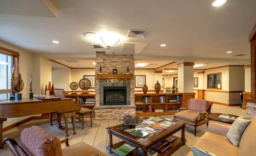 A cozy lounge area featuring a fireplace and comfortable seating.