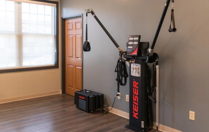 A modern indoor gym setup featuring a versatile exercise machine.