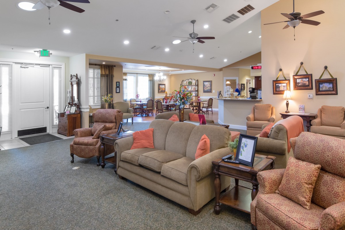 A cozy living room featuring comfortable seating and warm lighting.