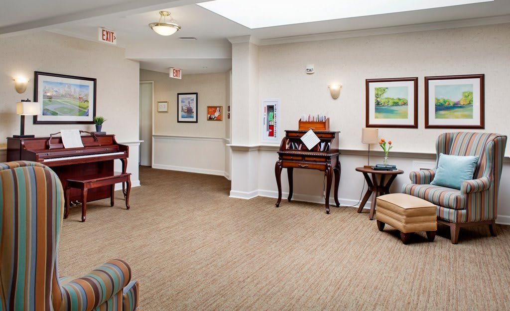 A well-decorated lobby area featuring elegant furniture and artwork.
