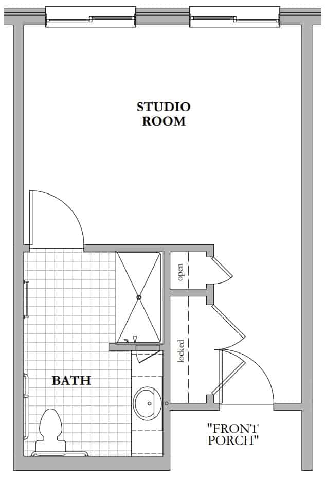 A floor plan of a studio apartment featuring a bathroom and an open studio room.