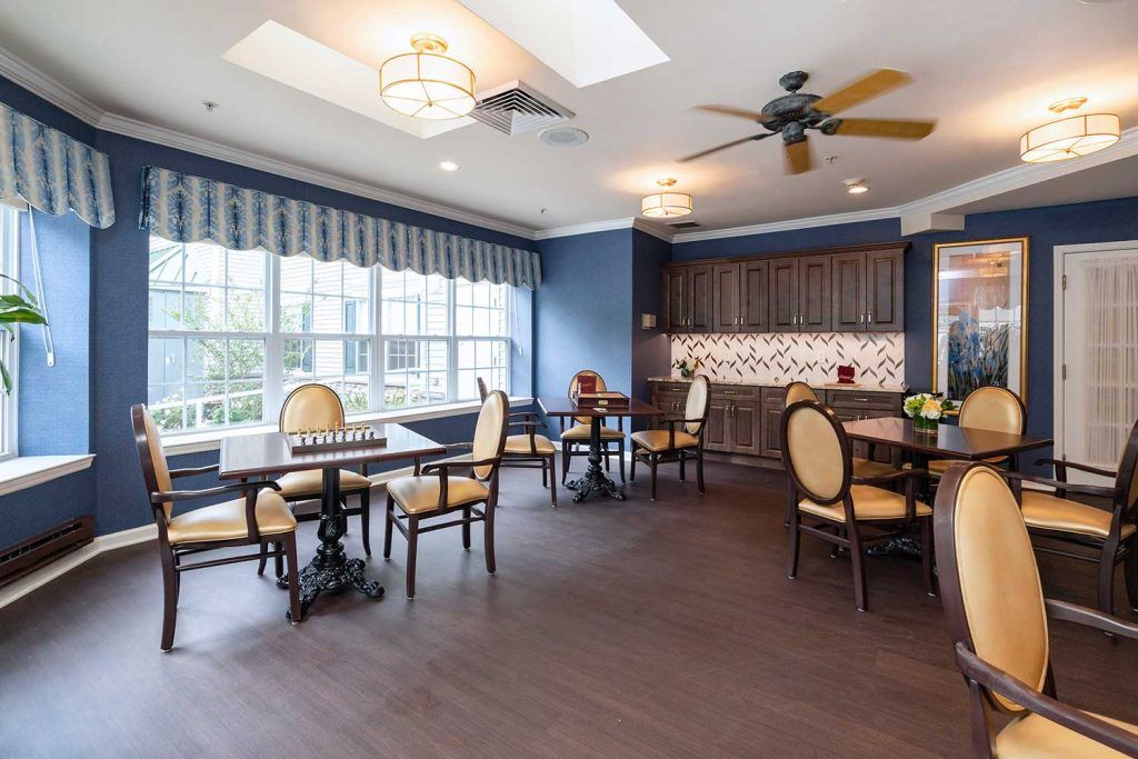 A cozy dining area with elegant furniture and natural lighting.