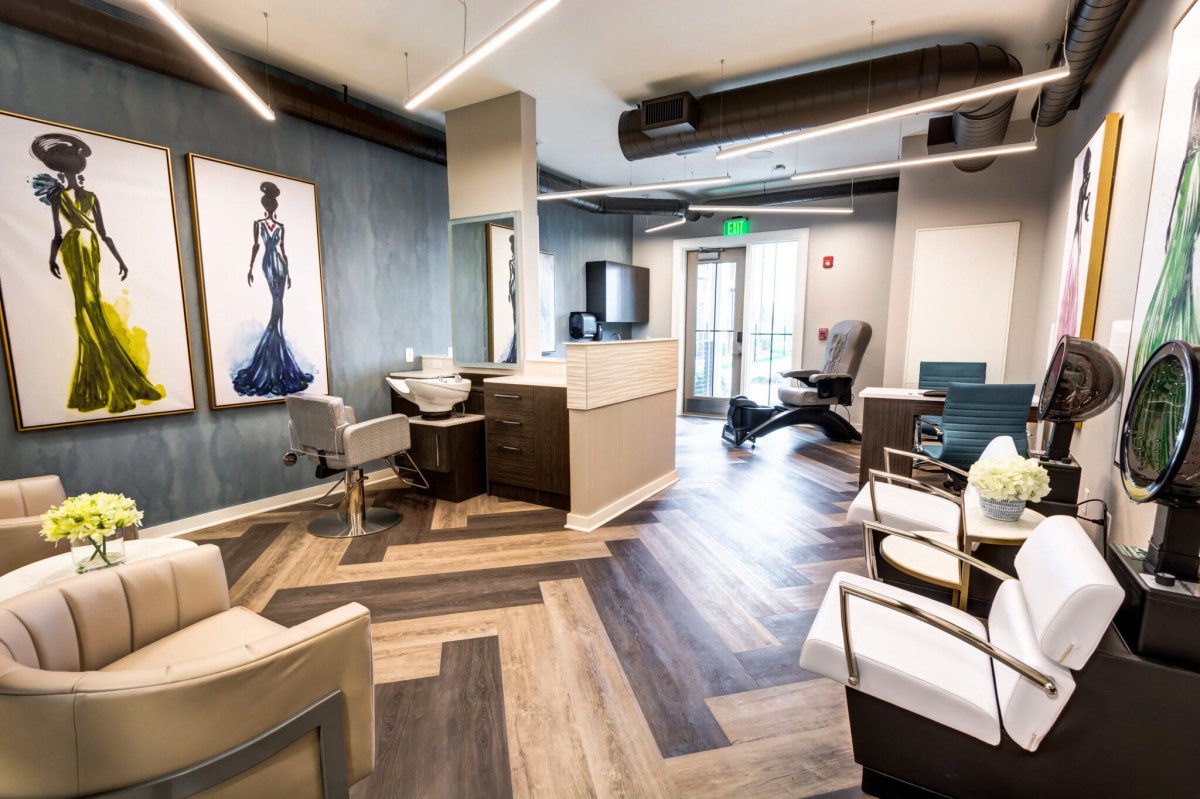 A modern reception area with stylish seating and contemporary artwork on the wall.