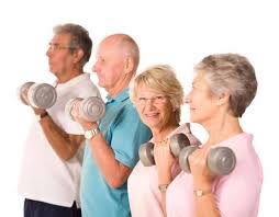 A group of seniors engaging in a weightlifting exercise together.
