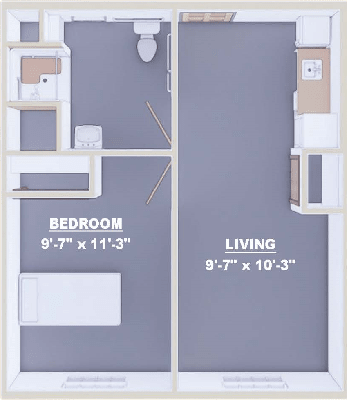 A simple floor plan showing a compact apartment with a bedroom, living area, bathroom, and kitchenette.