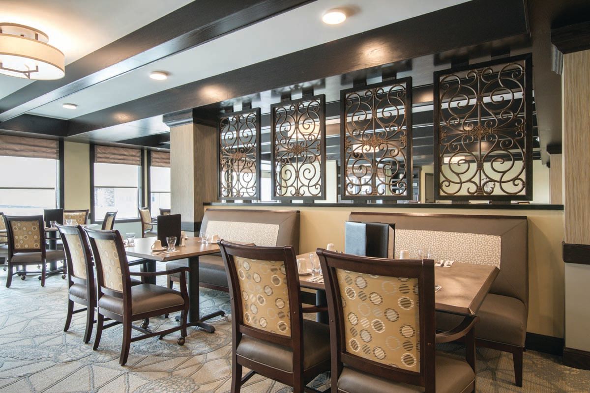 A stylish restaurant dining area with modern decor and comfortable seating.