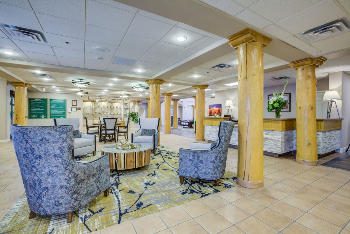 A spacious hotel lobby featuring comfortable seating and elegant decor.