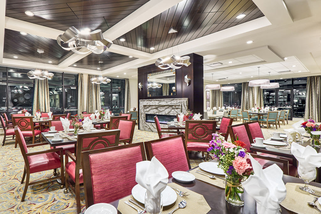 An elegant and modern restaurant dining room with neatly set tables and stylish decor.