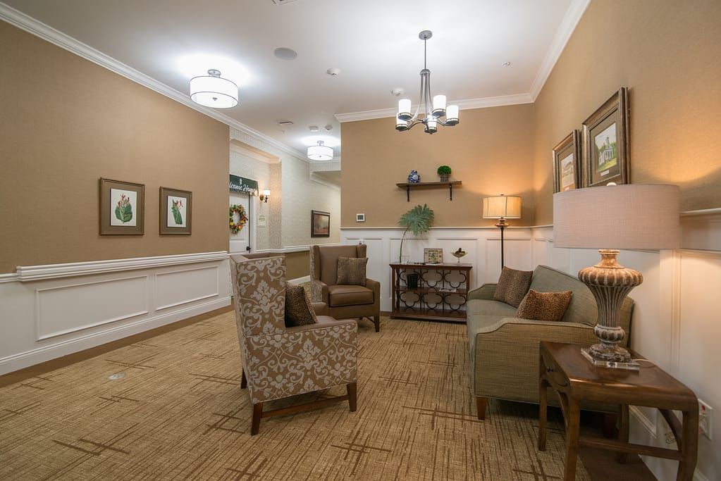 A cozy seating area with comfortable chairs and warm lighting.