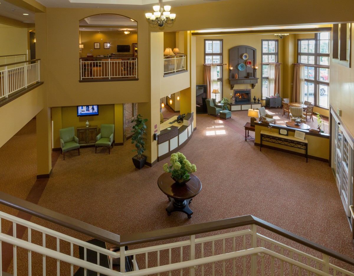 Elegant hotel lobby with a spacious reception area and grand staircase.