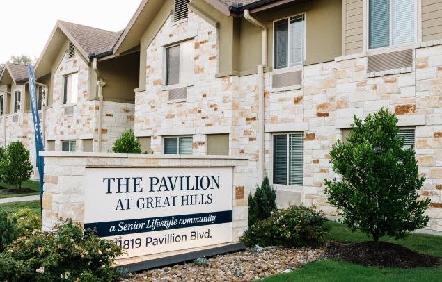 The Pavilion at Great Hills residential building with a prominent sign in front.