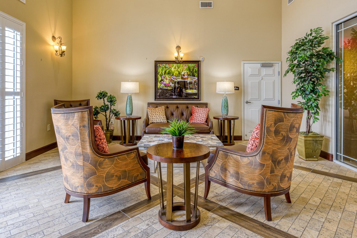 A cozy living room with elegant furniture and warm lighting.